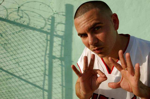 In 2003, Pitbull hangs out in the neighborhood he grew up in, near his mother's old house in Wynwood.